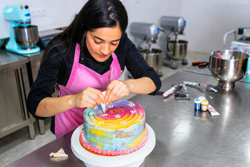Pastry Chef. Colombian woman chef decorates her cake