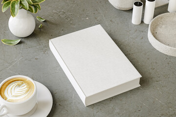 Hard cover book mock up on modern desk for presentation and advertising. 3D rendering
