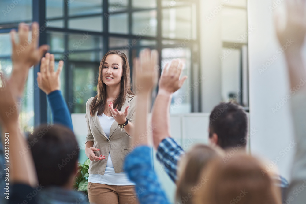 Poster woman speaker at seminar, audience with hands up for questions and answers at training presentation 