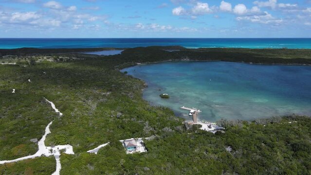 Beautiful cinematic aerial view of the Bahamas island - turquoise oceans, water sports sailing, beach walks, water bikes 
