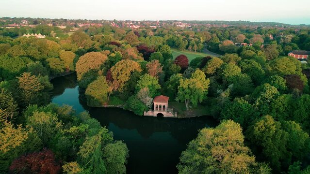 Birkenhead Park, upon which Central Park NY is based - Aerial drone at dawn, fast dronie from Roman Pavilion, lake reveal - May 23
