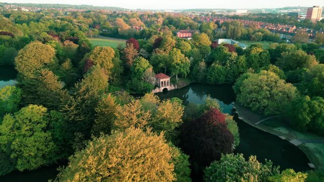 Birkenhead Park, upon which Central Park NY is based - Aerial drone at dawn, focus and approach Roman Pavilion - May 23