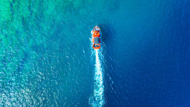 Wave and boat on the sea as a background. .Reef and waves from top view. Turquoise water background from top view. Summertime vacation. Top view from drone. Travel - image