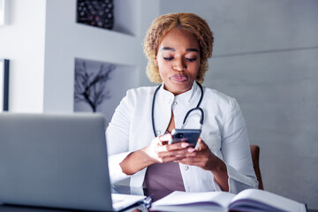 Female doctor chatting online with patient