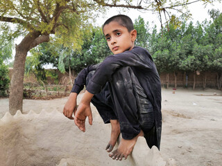 refugee boy waiting at the border