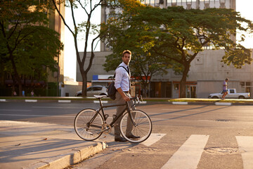 Crosswalk, bike and business man in city for morning, sustainable travel and carbon footprint....