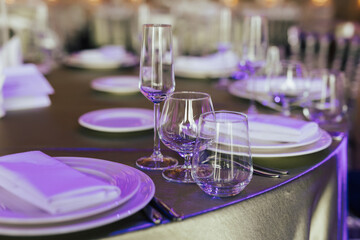 Close-up of table setting for holiday. Wedding table with cutlery for guests in the restaurant.