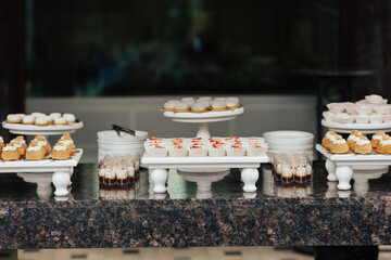 Candy bar for holidays. Reception for guests. Festively met guests with desserts, tarts and cupcakes.