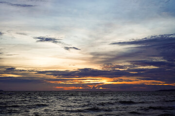 Obraz premium Dramatic clouds and blue sky during the rainy season before the sunset by the sea looks very romantic