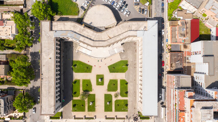 Aerial view of Palazzo Emme in Latina, Lazio, Italy. The building has the shape of an M like...