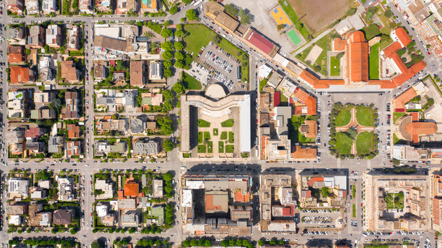 Aerial view of Palazzo Emme in Latina, Lazio, Italy. The building has the shape of an M like Mussolini's initial. It is a symbol of the rationalist italian architecture of the fascist period. - Powered by Adobe