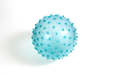 Blue massage ball with pimples on a white background