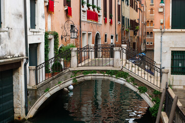Obraz na płótnie Canvas Narrow canals of Venice city with old traditional architecture, bridges and boats, Veneto, Italy. Tourism concept. Architecture and landmark of Venice. Cozy cityscape of Venice.
