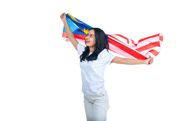 Asian women celebrate Malaysia independence day on 31 August by holding the Malaysia flag