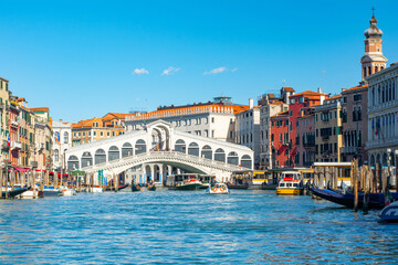 Fototapeta premium Stunning view of the Grand Canal of Venice, view of the Lagoon near The Rialto bridge in a sunny weather with clear sky, Italy