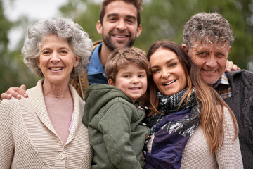 Family, grandparents and portrait of parents with kid in a park on outdoor vacation or holiday together. Face of old people, happiness and happy mother and father for love or care in nature