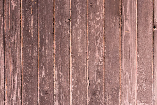 Old wooden background with cracked brown paint