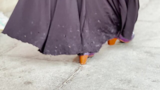 Feet of a female street flamenco dancer in Andalusia, Spain