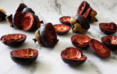 Mangosteen half skins on marble counter background