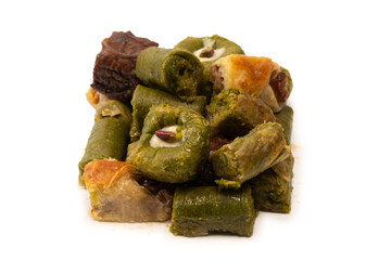 Turkish pistachio baklava isolated on a white background. A variety of turkish sweet baklava.