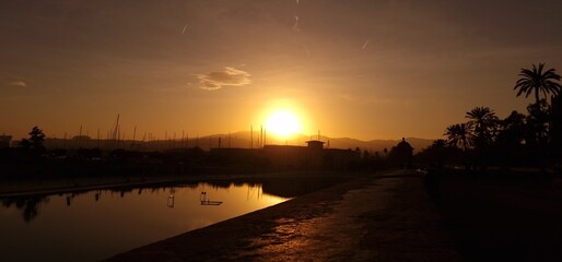 Description: The sunset in Palma de Mallorca is a breathtaking sight, casting warm hues of orange, pink, and gold across the sky. As the sun gradually dips below the horizon, it creates a mesmerizing  © Michaela Holubová