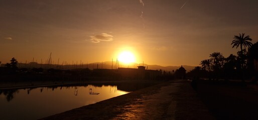 Description: The sunset in Palma de Mallorca is a breathtaking sight, casting warm hues of orange, pink, and gold across the sky. As the sun gradually dips below the horizon, it creates a mesmerizing  © Michaela Holubová