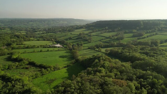 Fast drone footage over fields and tress in the Blackdown hills on the Devon and Somerset border
