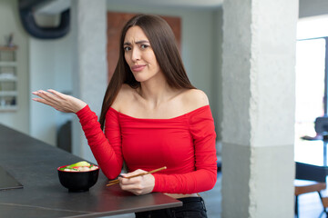 shrugging, feeling confused and uncertain. ramen noodles bar concept