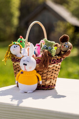 handmade dolls in a basket, taken on a sunny day