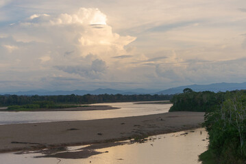 Peruvian Amazon River and Forest with a big cumulonimbus clouds