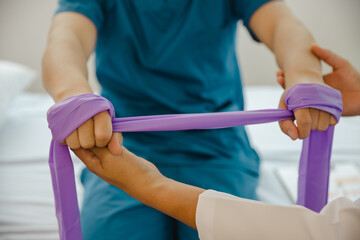 physical therapist helping man physical therapy rehabilitation