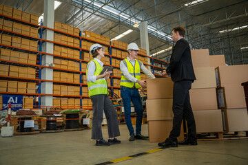 Meeting at warehouse,Warehouse managers with warehouse workers have a briefing in a large distribution center,Concept of teamwork and occupation.