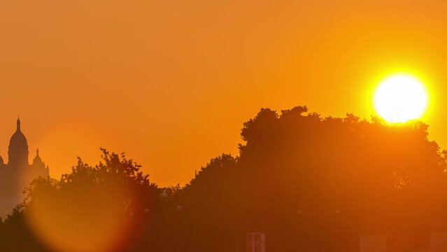 Bridge near Eiffel tower and the Seine river timelapse, Paris, France. Orange sky. Morning view from Bir-Hakeim bridge near Eiffel tower