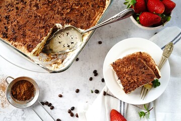 Homemade Tiramisu with ladyfingers base - italian dessrtm selective focus