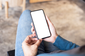 cell phone blank white screen mockup.hand holding texting using mobile on desk at office.background empty space for advertise.work people contact marketing business,technology