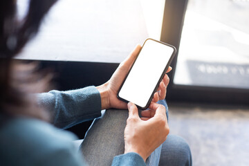 cell phone blank white screen mockup.hand holding texting using mobile on desk at office.background empty space for advertise.work people contact marketing business,technology