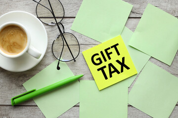 Photo of many multi-colored stickers with the text GIFT TAX attached to a wooden board