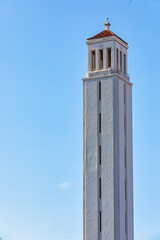 Obraz premium Marathon Tower next to the New Stadium in Castellón de la Plana, Spain: Iconic Architectural Landmarks under a Clear Blue Sky