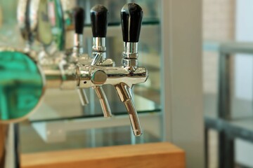 Taps for pouring beer in a beer bar