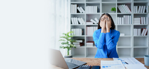 Portrait of business owner, woman using computer and financial statements Anxious expression on expanding the market to increase the ability to invest in business
