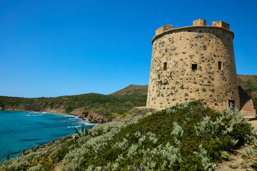 Fototapeta na wymiar Sea watchtower on the Sardinian coast