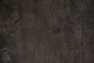 The stone surface is dark in color. The texture of old flagstone in the grunge style. Overlay for your design with copy space. High quality photo