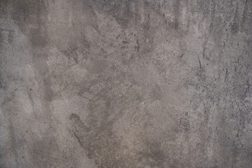 The texture of a gray stone wall with lightened spots. An overlay for your design with copy space. High quality photo