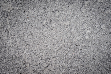 Dark grainy abstract background, texture of recycled rubber asphalt road texture, concrete