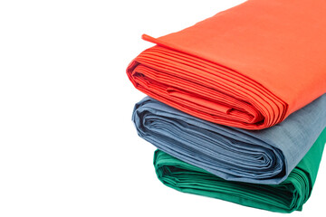 Three multi-colored rolls of fabric on a white background