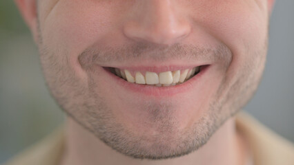Close Up of Smiling Male Lips and Teeth