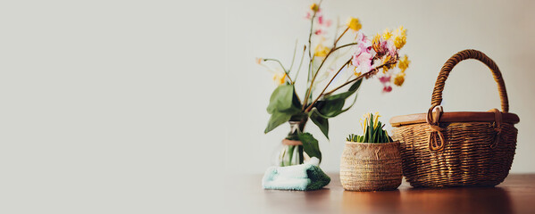 A Picture of Clean. A Basket of Cleaning Items on a Wooden Table Surrounded by Spring Flowers. generative ai