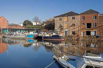 Skyline of the historic quayside of Exeter in Devon at sunrise, UK