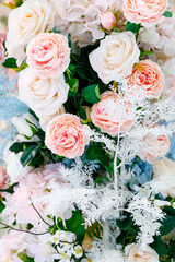 Delicate light pink bouquet of mixed flowers during the day in bright sunlight. High quality photo