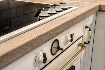 Kitchen detail. Part of modern stove with ceramic surface. 